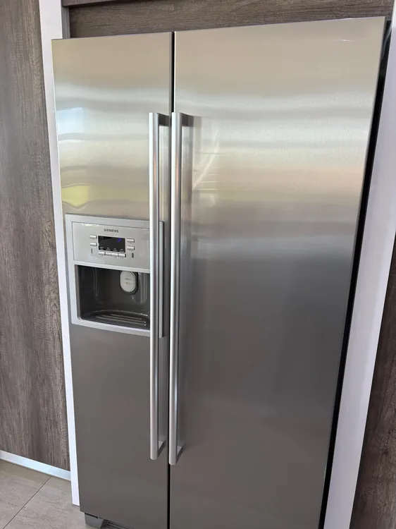 Technician providing freezer repair service in Durban North